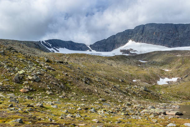 istock Glacier moraine in a wild mountain landscape with a glacier 1329368482