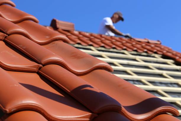 Roofing work, new covering of a tiled roof stock photo