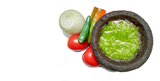 traditional mexican  green tomato sauce in molcajete, with copy space. - molho verde imagens e fotografias de stock