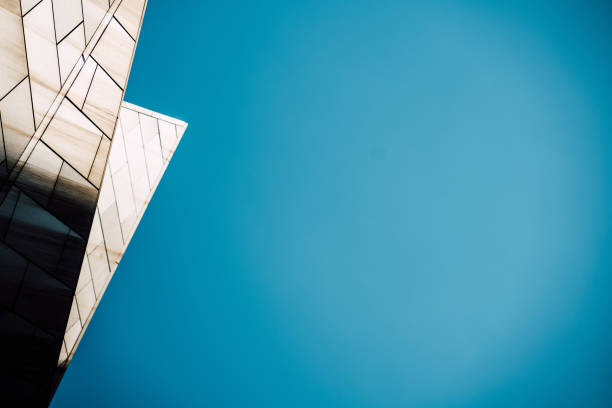 istock underside panoramic and perspective view to steel blue glass high rise building skyscrapers, business concept of successful industrial architecture 1329370791