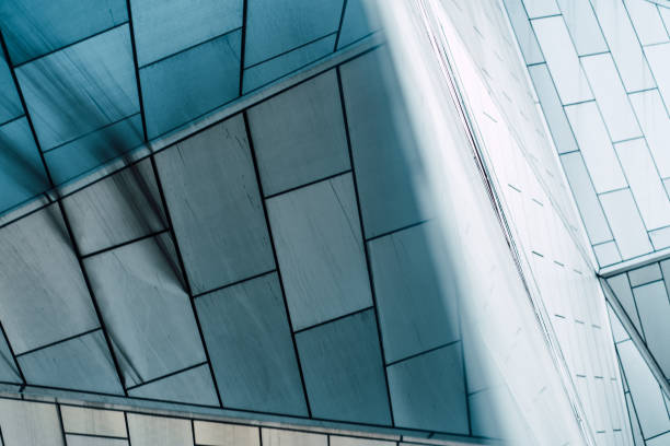 istock underside panoramic and perspective view to steel blue glass high rise building skyscrapers, business concept of successful industrial architecture 1329370943