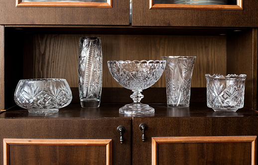 set of crystal vases on the shelf