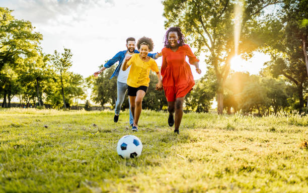 istock Mixed race family playing soccer 1329373534