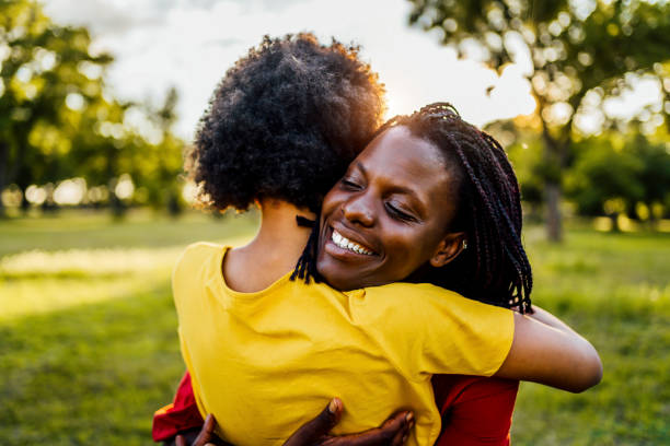 istock Mom and daughter hugging 1329373616