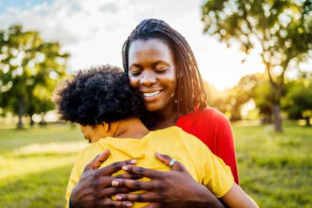 istock Mom and daughter hugging 1329373958