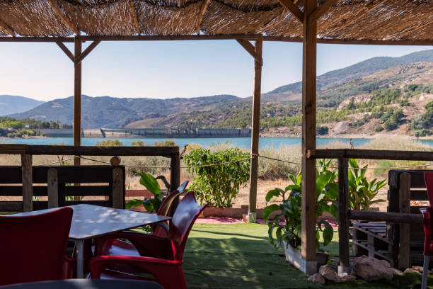 istock Beznar dam seen from the terrace with cane fields in its recreational area. 1329375783