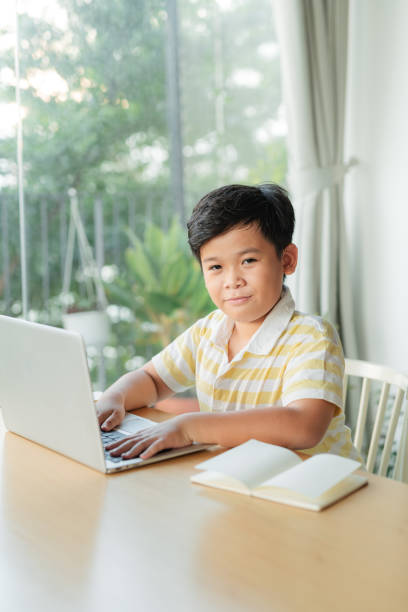 istock Boy student study online with video call teacher. 1329375872