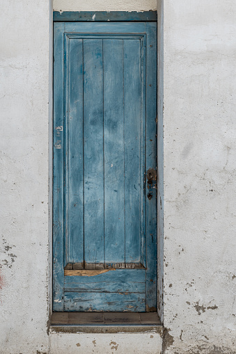 Rustic blue wooden door of a rural house