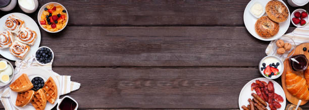 istock Breakfast or brunch double border on a dark wood banner background 1329380655