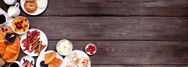 istock Breakfast or brunch corner border on a dark wood banner background 1329381216