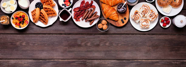 istock Breakfast or brunch top border on a dark wood banner background 1329381297