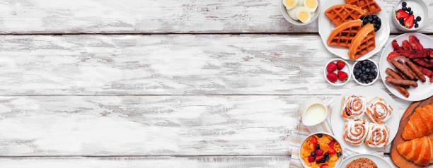 istock Breakfast or brunch side border on a white wood banner background 1329381506