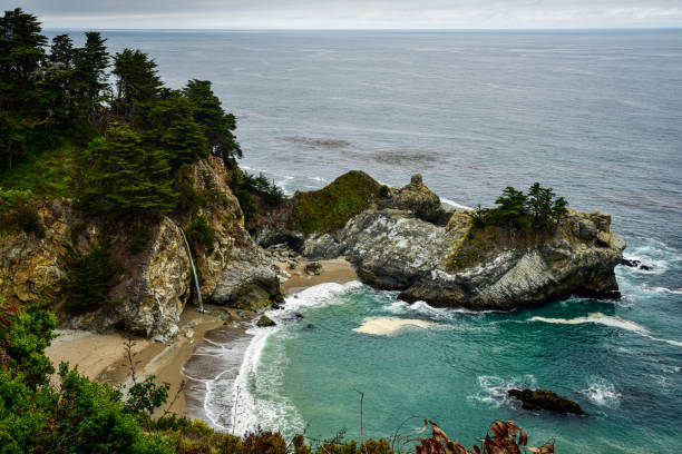 istock waterfall on Pacific Coast beach rocky coastline 1329384747