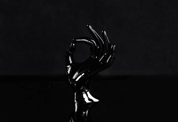 istock black hand in black oil 1329385338