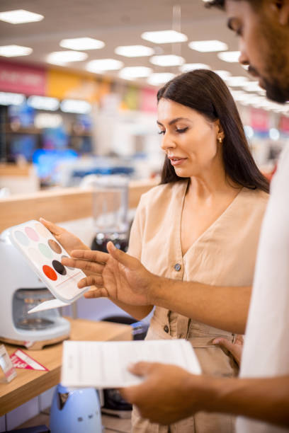 istock Woman choosing a perfect colour for her kitchen appliances 1329385424