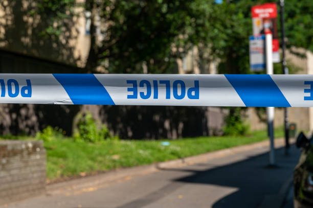 istock Police cordon tape across a crime scene 1329385687