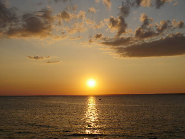 istock yellow sun sets over the sea 1329387777