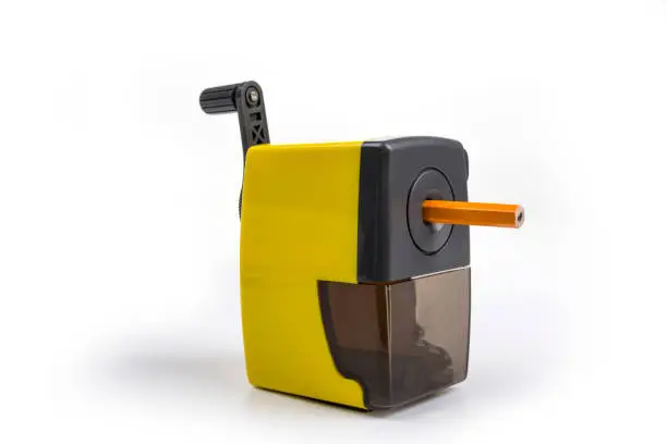 Pencil sharpener with a hand crank on a white