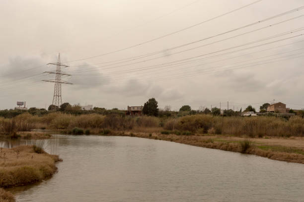 istock high voltage power lines over the river 1329391314