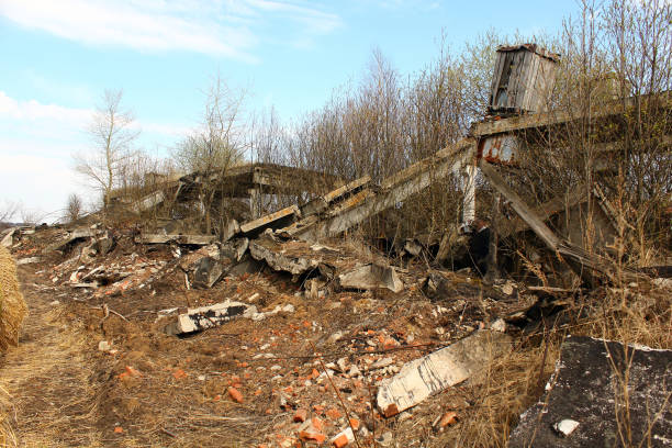 Farm hangar destroyed by weather after economic crisis. Destroyed abandoned building ruins.