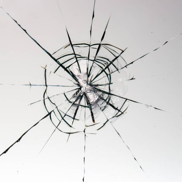 istock Cracks on the glass on a white background. 1329393109