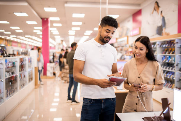 istock Beautiful female customer receiving assistance 1329394257
