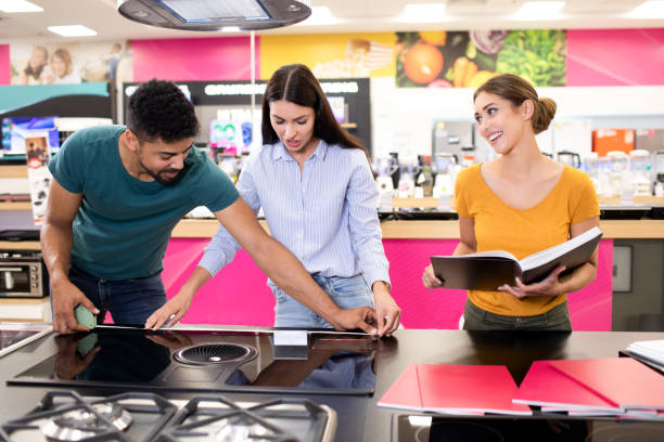istock Saleswoman helps customers about measurements 1329394310