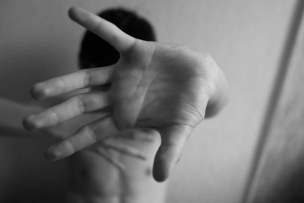 istock A young guy protects himself with an open palm 1329398015