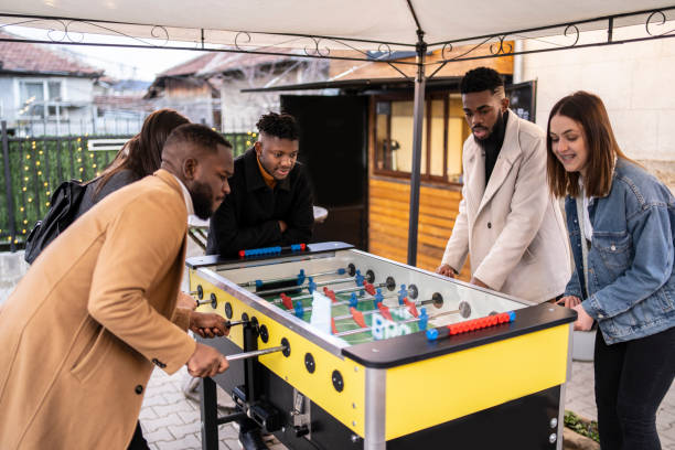 istock Friends playing soccer table and having fun 1329399012