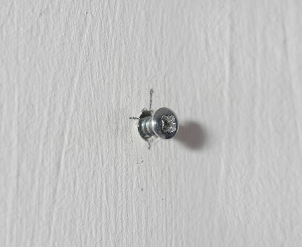 istock A worn out screw in the wall. Difficulty at work. Erased, abraded 1329399967