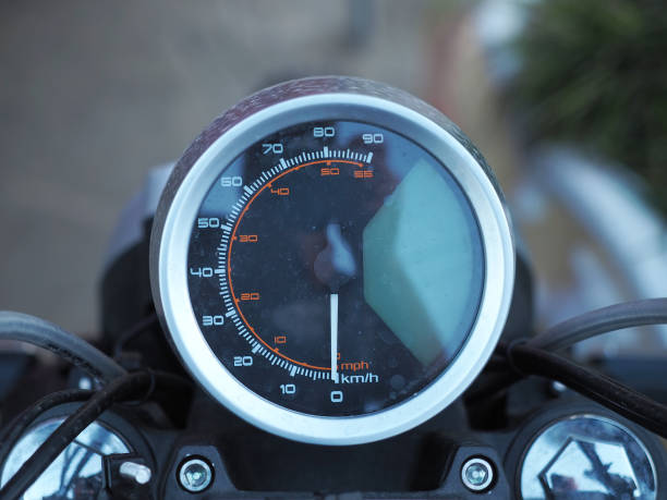 istock Round black spattered motorcycle speedometer. Front view. Closeup photo with blurred background 1329401242