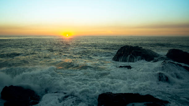 istock View of the ocean surf during a stunning sunset. 1329404171
