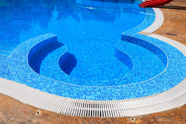 istock Swimming pool with clear water at a tropical resort 1329404870