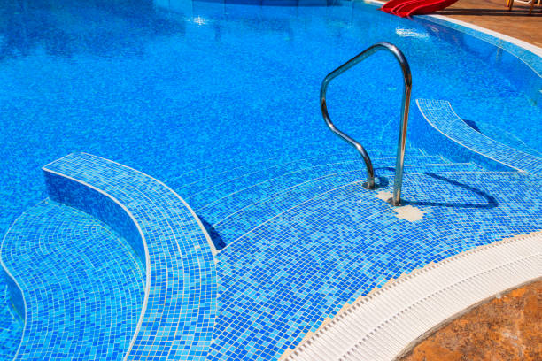 istock Swimming pool with clear water at a tropical resort 1329404872