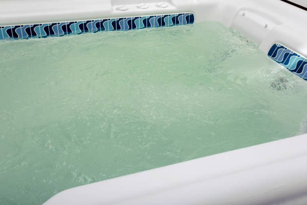 istock bubbling water in hot hot tub close up, spa background, copy space 1329406784