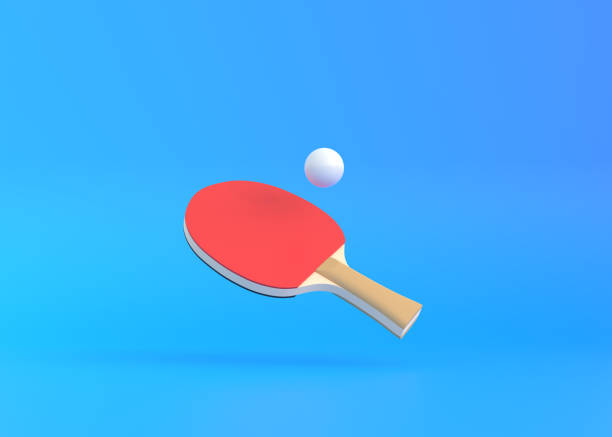 istock Red racket for table tennis with white ball on blue background 1329407148