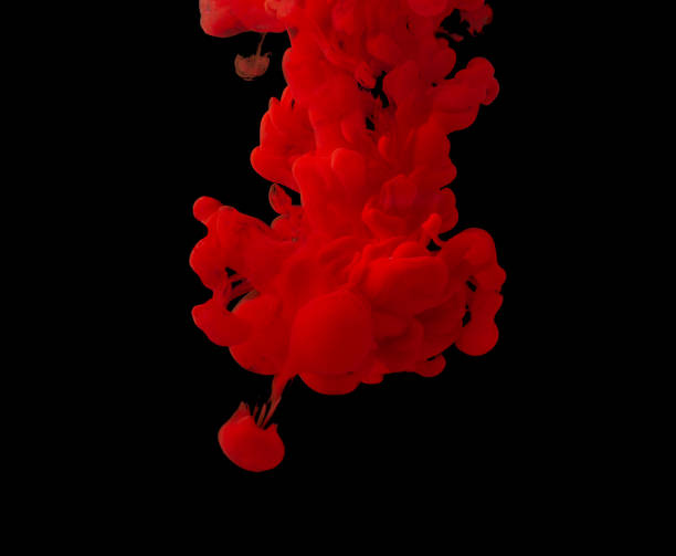 istock explosion of acrylic red paint in clear water. Black background 1329411233