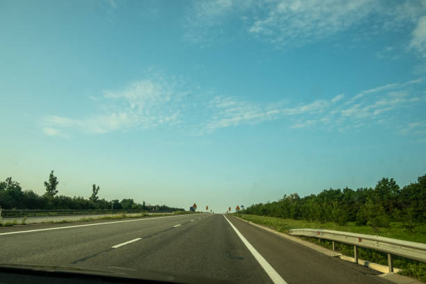 istock Asphalt highway in the fog. 1329411579