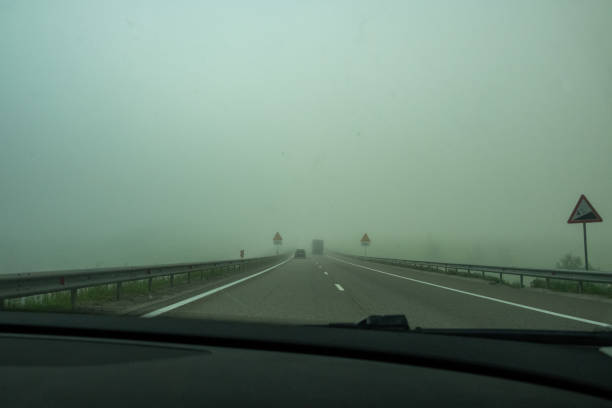 istock Asphalt highway in the fog. 1329411997