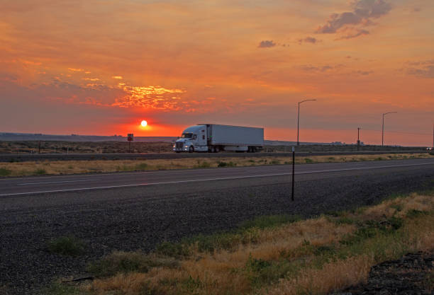 istock Sunrise over desert highway 1329412031