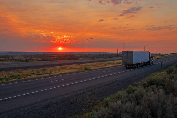 istock Sunrise over desert highway 1329412032