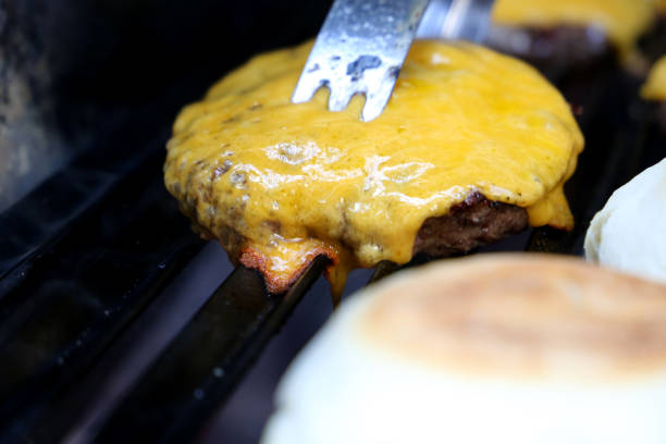 istock hamburger on the parrilla grill with grill marks 1329417871