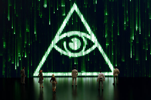 Matrix: All seeing eye Businessman/politician figurines examine a matrix style illuminati symbol. Artificial intelligence/technology/digital age concept conspiracy photos stock pictures, royalty-free photos & images