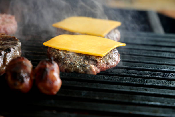 istock hamburger on the parrilla grill with grill marks 1329418781