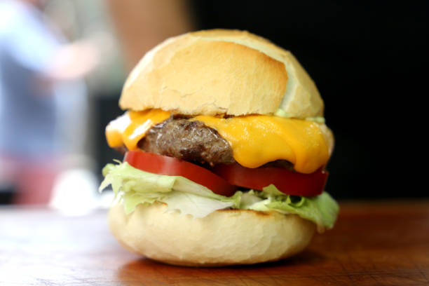 istock cheese salad burger on a wooden background 1329418790