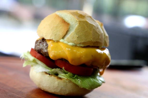 istock cheese salad burger on a wooden background 1329418823