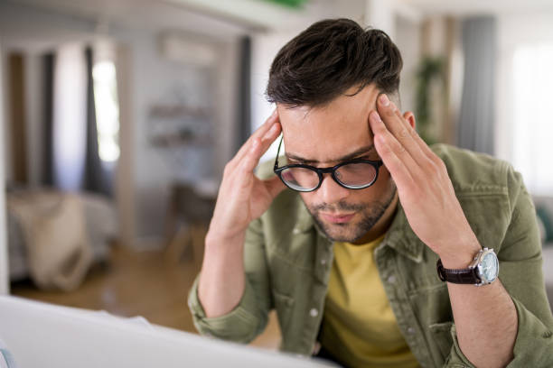 istock Tired young entrepreneur working at home. 1329419823