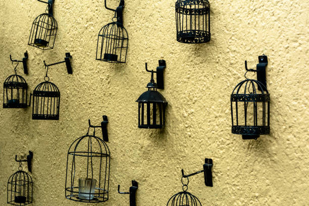 small metal cages decorating a wall