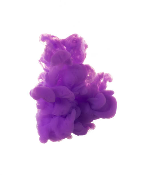 istock dissolving clouds of purple ink in water on a white background. 1329422486