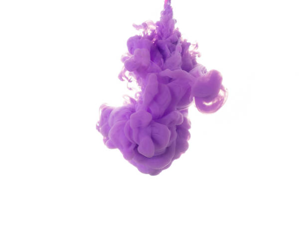 istock dissolving clouds of purple ink in water on a white background. 1329422489